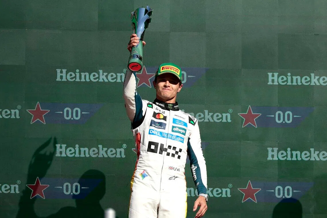 Britain's Lando Norris of McLaren celebrates after winning first place in the Mexico City Grand Prix.