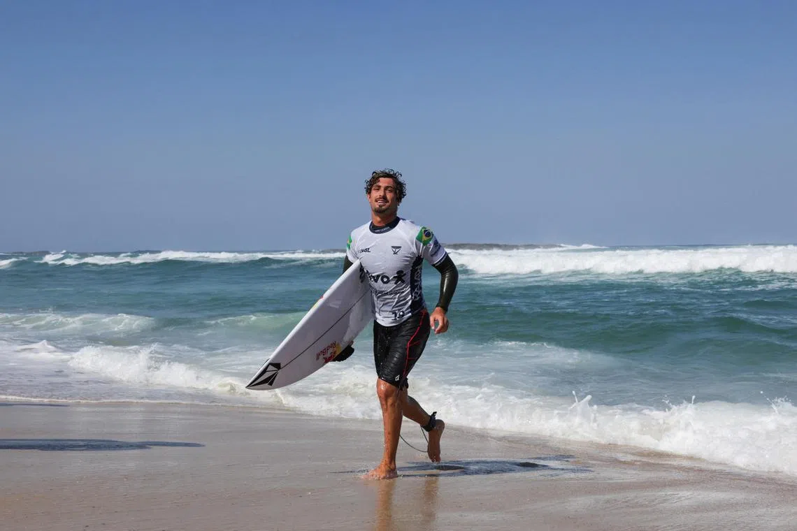 Brazil's Joao Chianca walks out from the sea during the World Surf League Rio Pro in Saquarema, Brazil on June 26, 2024.