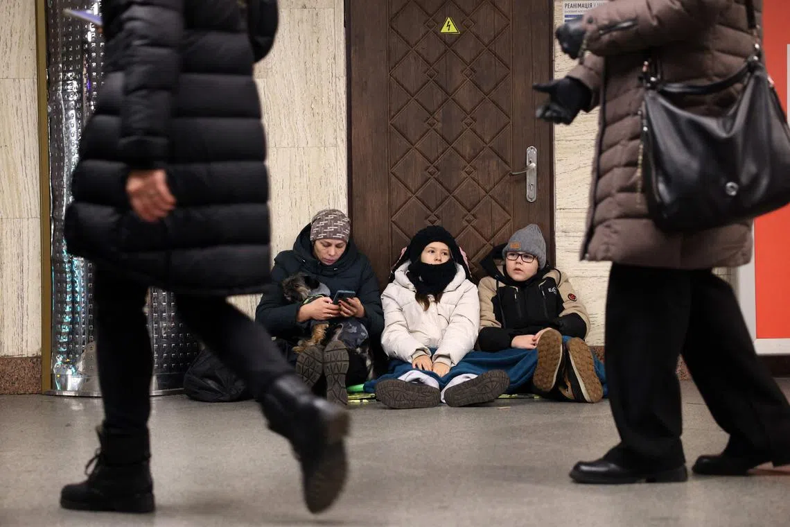 Kyiv residents taking shelter in a metro station during an attack by Russia on Dec 31.
