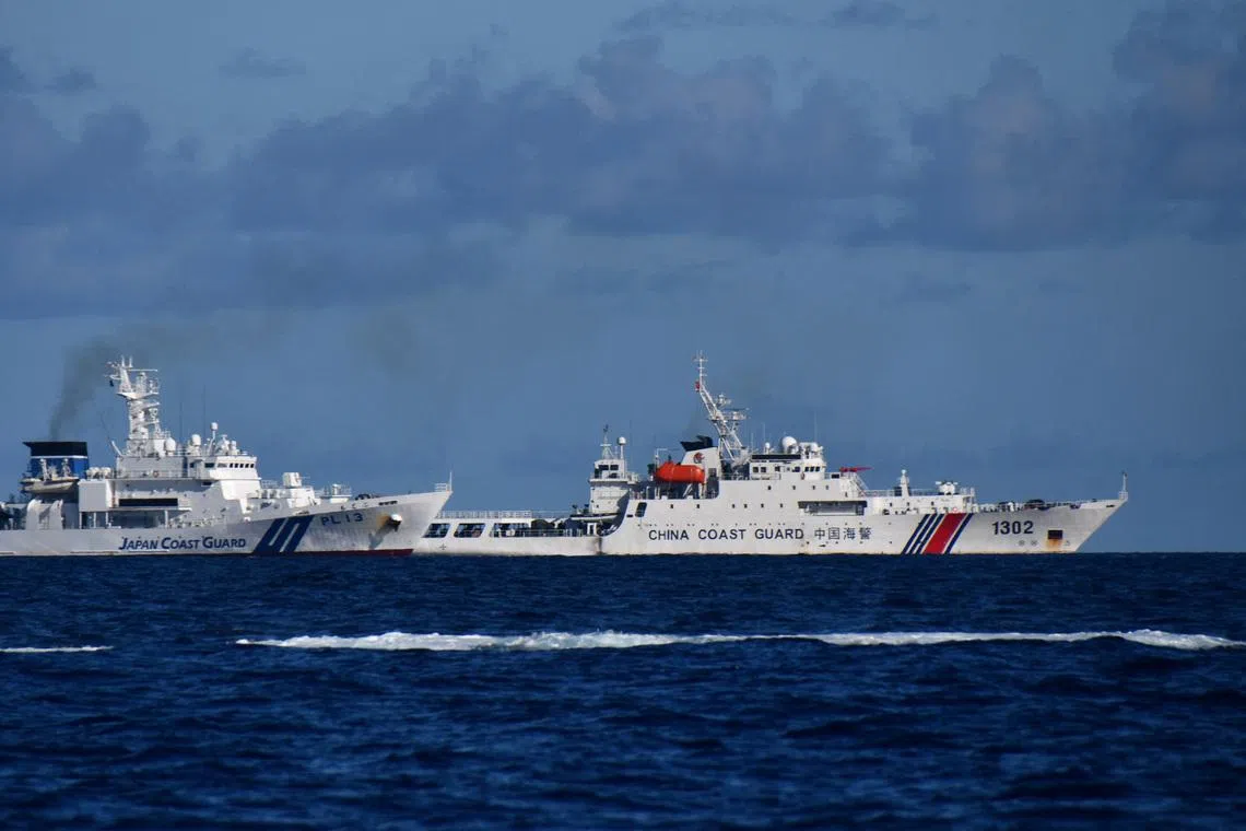 A China Coast Guard vessel sails near a Japan Coast Guard vessel around a group of disputed islands called Senkaku Islands in Japan, also known in China as Diaoyu Islands, September 14, 2025. Hitoshi Nakama/Handout via REUTERS/File Photo