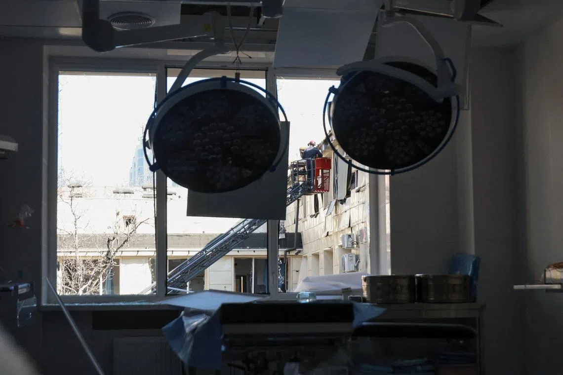 A rescuer works at the site of a maternity hospital which was hit during overnight Russian drone strikes, amid Russia's attack on Ukraine, in Odesa, Ukraine March 28, 2026. REUTERS/Nina Liashonok