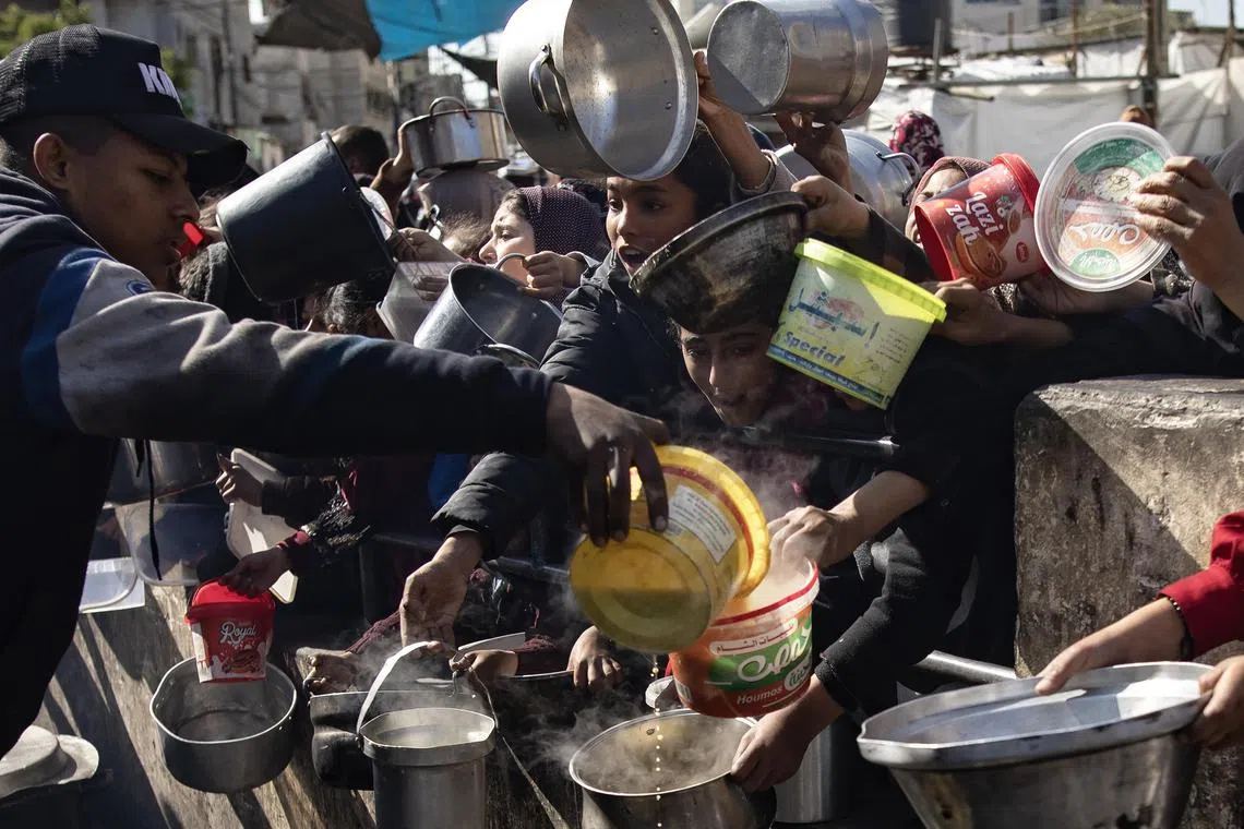 Gaza Health Ministry says 20 Palestinians killed in strike on food aid ...