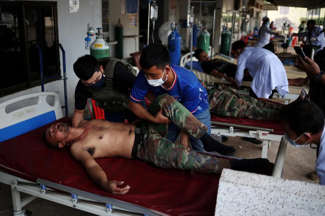A wounded Cambodian soldier arrives at a hospital in Cambodia’s Banteay Meanchey province.    
