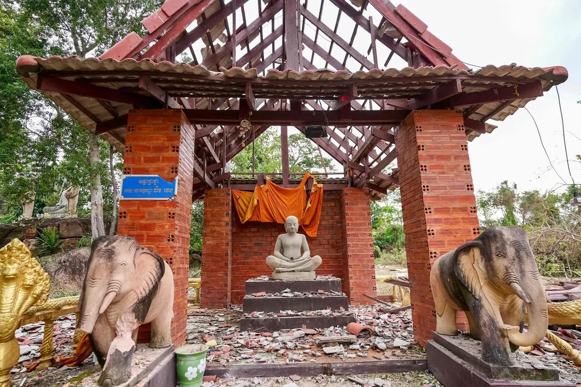 A pagoda damaged by Thai artillery is pictured in Oddar Meanchey province on July 25, 2025. Thailand's acting Prime Minister Phumtham Wechayachai warned on July 25 that cross-border clashes with Cambodia that have uprooted more than 130,000 people "could develop into war", as the countries traded deadly strikes for a second day. (Photo by AFP)