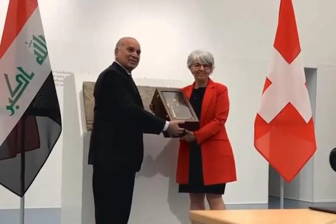 Swiss foreign minister Elisabeth Baume-Schneider handed over a partial statue and two Mesopotamian reliefs to Iraqi Foreign Minister Fuad Hussein.
