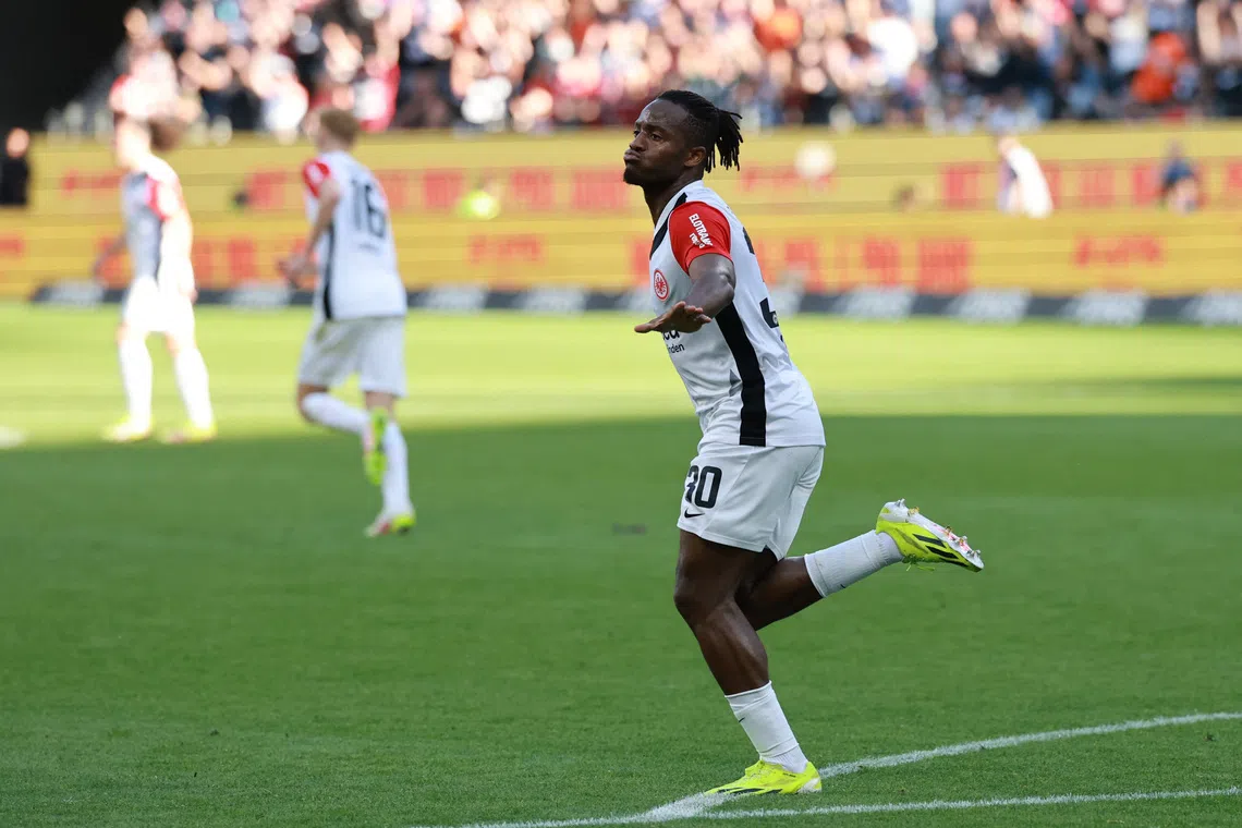 Soccer Football - Bundesliga - Eintracht Frankfurt v St Pauli - Deutsche Bank Park, Frankfurt, Germany - May 11, 2025 Eintracht Frankfurt's Michy Batshuayi celebrates scoring their second goal REUTERS/Kai Pfaffenbach