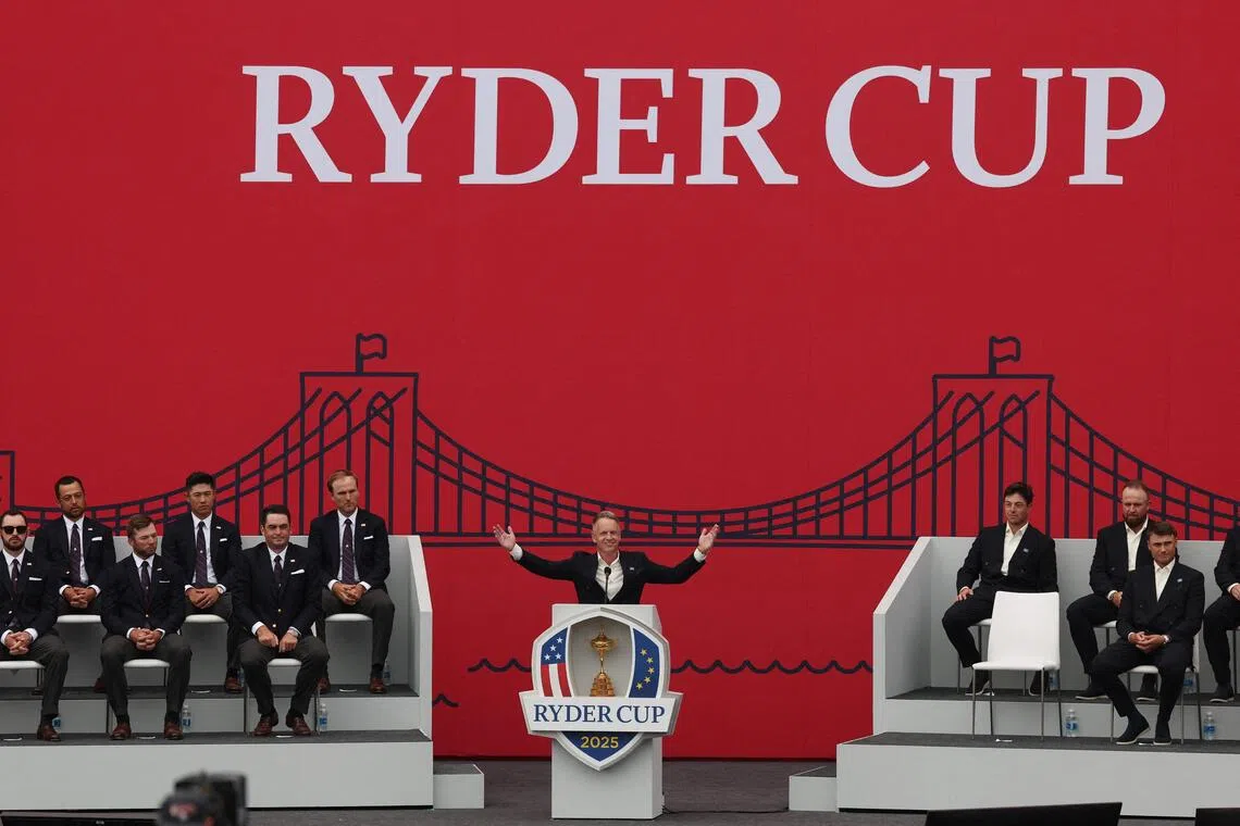 Team Europe captain Luke Donald speaks to the crowd during the opening ceremony as Team USA captain Keegan Bradley looks on.