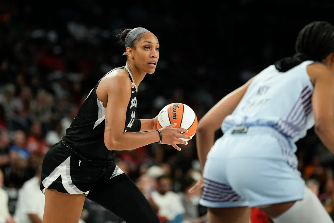 Aug 28, 2026; Las Vegas, Nevada, USA;  Las Vegas Aces center A'ja Wilson (22) controls the ball against the Toronto Tempo during the second quarter of a WNBA basketball game at Michelob Ultra Arena.  Mandatory Credit: Lucas Peltier-Imagn Images