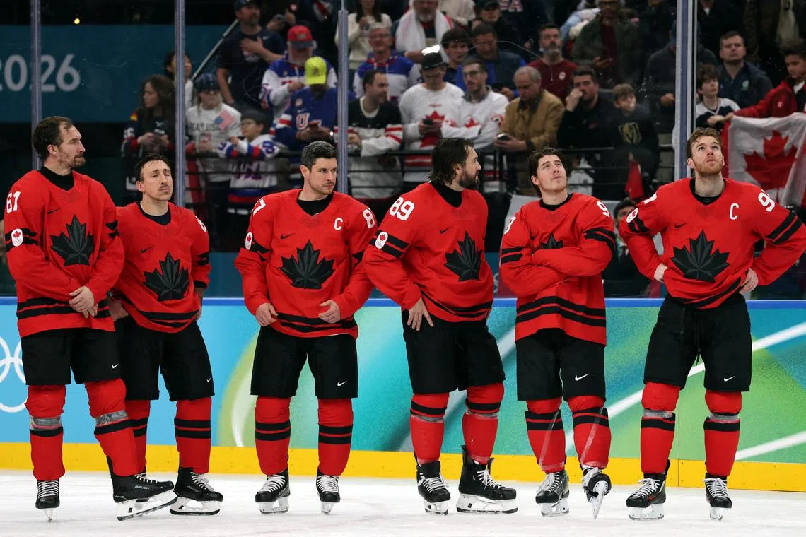 Milano Cortina 2026 Olympics - Ice Hockey - Men's Gold Medal Game - Canada vs United States - Milano Santagiulia Ice Hockey Arena, Milan, Italy - February 22, 2026. Canada players look dejected after Jack Hughes of United States scores their second goal in overtime to win gold REUTERS/Mike Segar     TPX IMAGES OF THE DAY