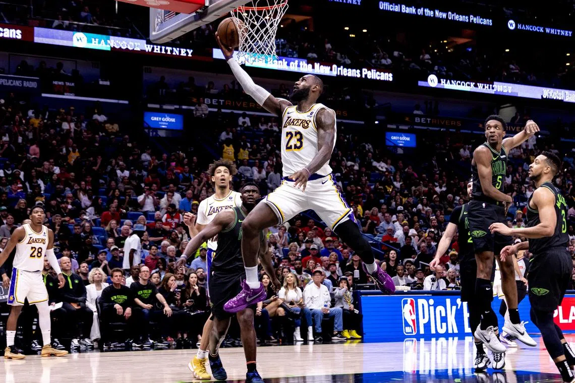 Los Angeles Lakers forward LeBron James drives to the basket against New Orleans Pelicans forward Herbert Jones during the second half at Smoothie King Centre on April 14, 2024.