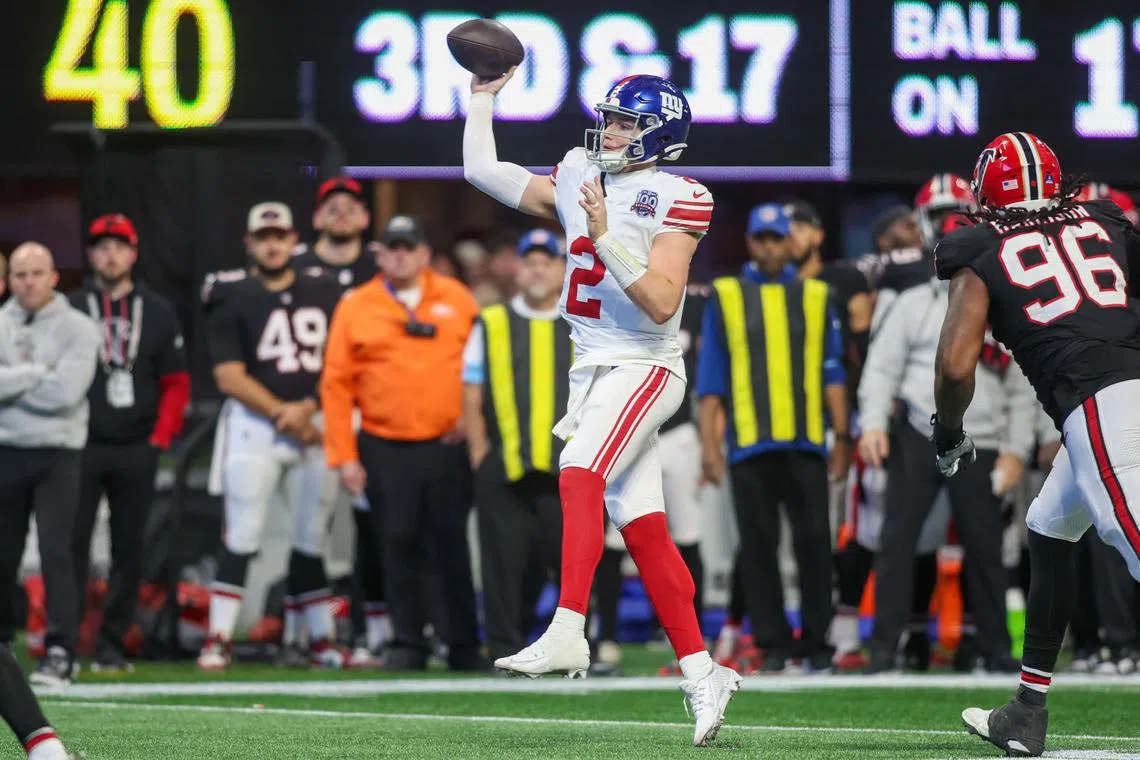 Dec 22, 2024; Atlanta, Georgia, USA; New York Giants quarterback Drew Lock (2) throws a pass against the Atlanta Falcons in the fourth quarter at Mercedes-Benz Stadium. Mandatory Credit: Brett Davis-Imagn Images