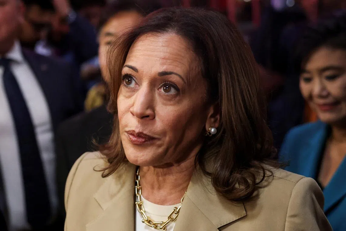 FILE PHOTO: U.S. Vice President Kamala Harris looks on as she visits the Reading Terminal Market in Philadelphia, Pennsylvania, U.S., July 13, 2024. REUTERS/Kevin Mohatt/File Photo