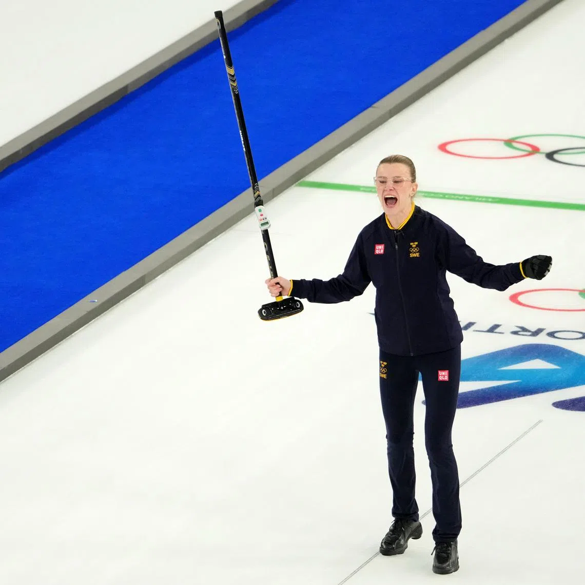 Feb 10, 2026; Cortina d'Ampezzo, Italy; Isabella Wranaa of Sweden celebrates after winning the curling mixed doubles gold medal game during the Milano Cortina 2026 Olympic Winter Games at Cortina Curling Olympic Stadium. Mandatory Credit: Eric Bolte-Imagn Images