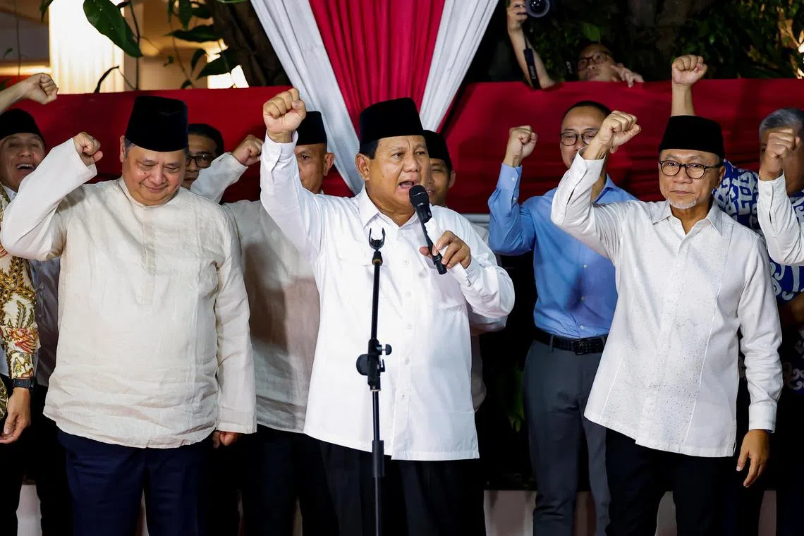 Indonesia's front-runner presidential candidate and Defence Minister Prabowo Subianto, along with his coalition members, gesture as he delivers his speech after the country's election commission announced last month's presidential election result, in Jakarta, Indonesia, March 20, 2024. REUTERS/Willy Kurniawan