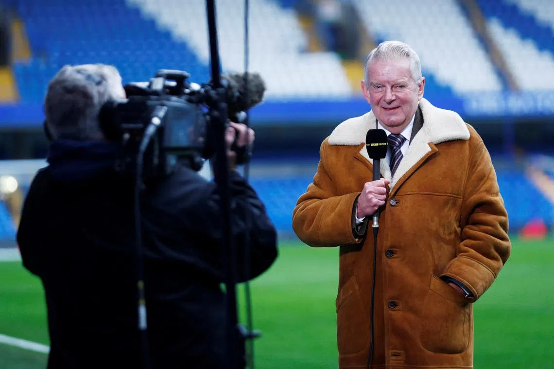 John Motson doing television work at Stamford Bridge before the match between Chelsea and Stoke City.