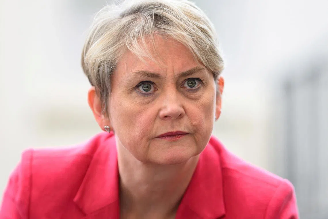 FILE PHOTO: LIVERPOOL, ENGLAND - SEPTEMBER 21: Home Secretary Yvette Cooper speaks with members of the local community during a visit to the recently refurbished Spellow library on September 21, 2024 in Liverpool, England. Leon Neal/Pool via REUTERS/File Photo