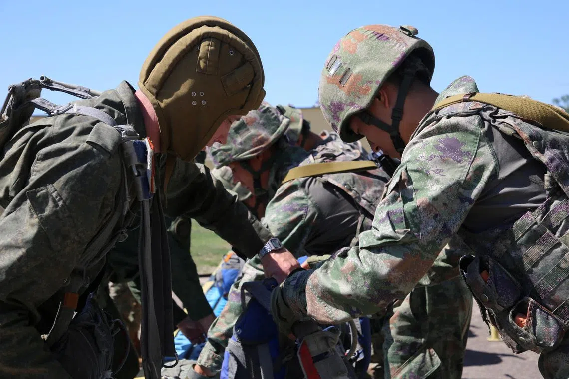 Service members take part in the joint military exercises of the armies of Belarus and China "Falcon Assault" at an undisclosed location in Belarus, in this handout picture released July 9, 2024.