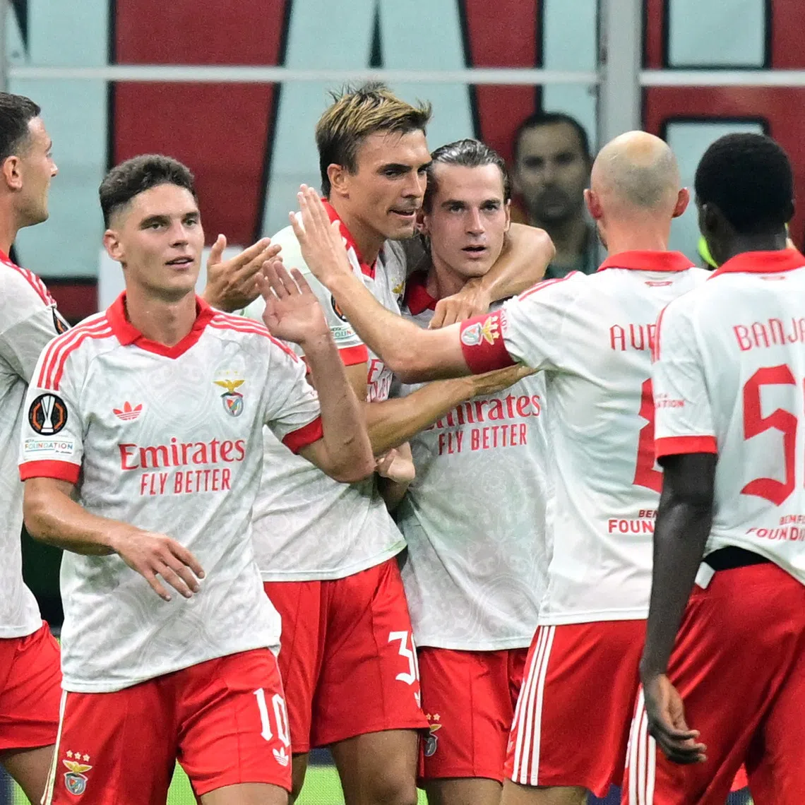 Soccer Football - UEFA Europa League - AC Milan v Benfica - San Siro, Milan, Italy - September 16, 2026 Benfica's Jakub Kaminski celebrates scoring their second goal with teammates REUTERS/Daniele Mascolo