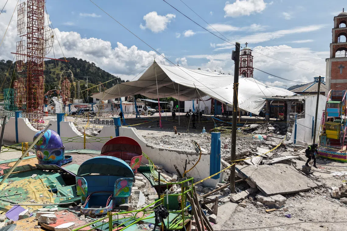 A drone view showing the damage after a fireworks explosion that left at least 10 people dead at a village festival in central Mexico.