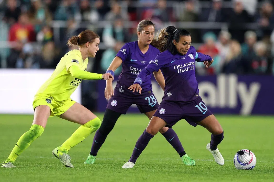 Marta of the Orlando Pride and Hal Hershfelt of the Washington Spirit battle for the ball during the second half of the NWSL 2024 Championship Game.