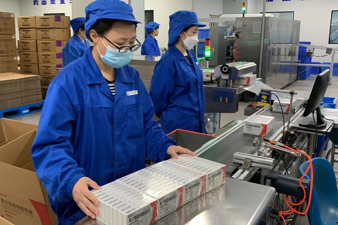 Workers packing fever-reducing medication at a pharmaceutical factory in Beijing owned by the Youcare Pharmaceutical Group. Since Beijing’s abrupt about-turn from its zero-Covid policy the firm like many other Chinese drugmakers have ramped up medicine production. It now produces 150 thousand boxes of its cold medication a day, which contains the anti-pyretic paracetamol, five times more than before.
