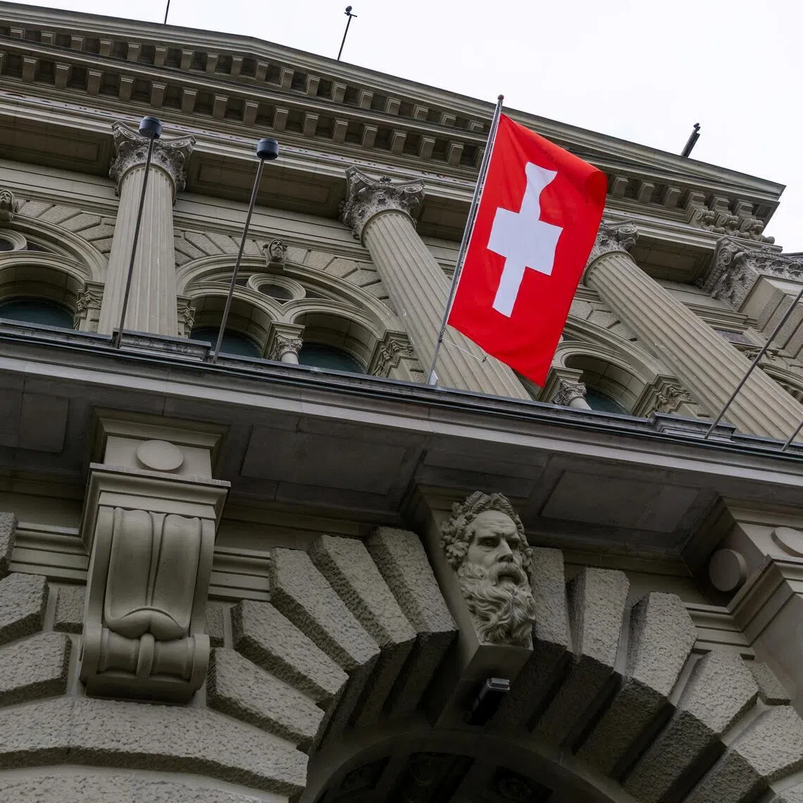 A Swiss flag outside Switzerland's Parliament building in Bern.