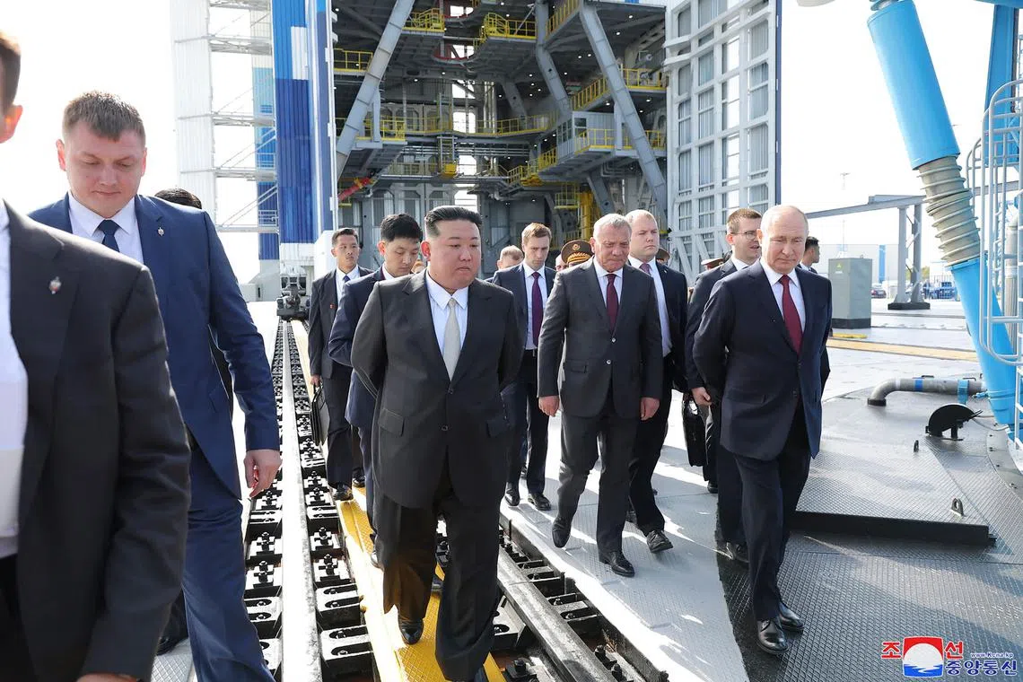 North Korea's leader Kim Jong Un (centre) and Russia's President Vladimir Putin (right) visit the Vostochny Cosmodrome.