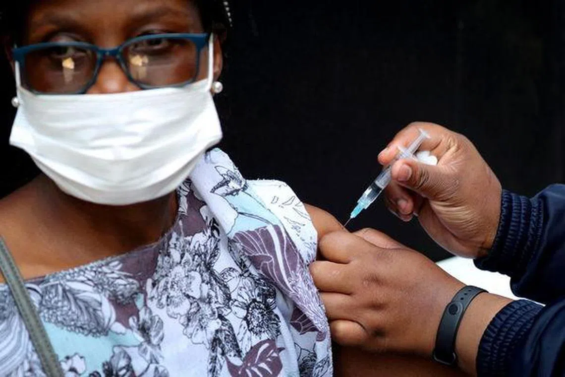 A healthcare worker administers the Covid-19 vaccination to a woman in Johannesburg, South Africa, in August 2021. 