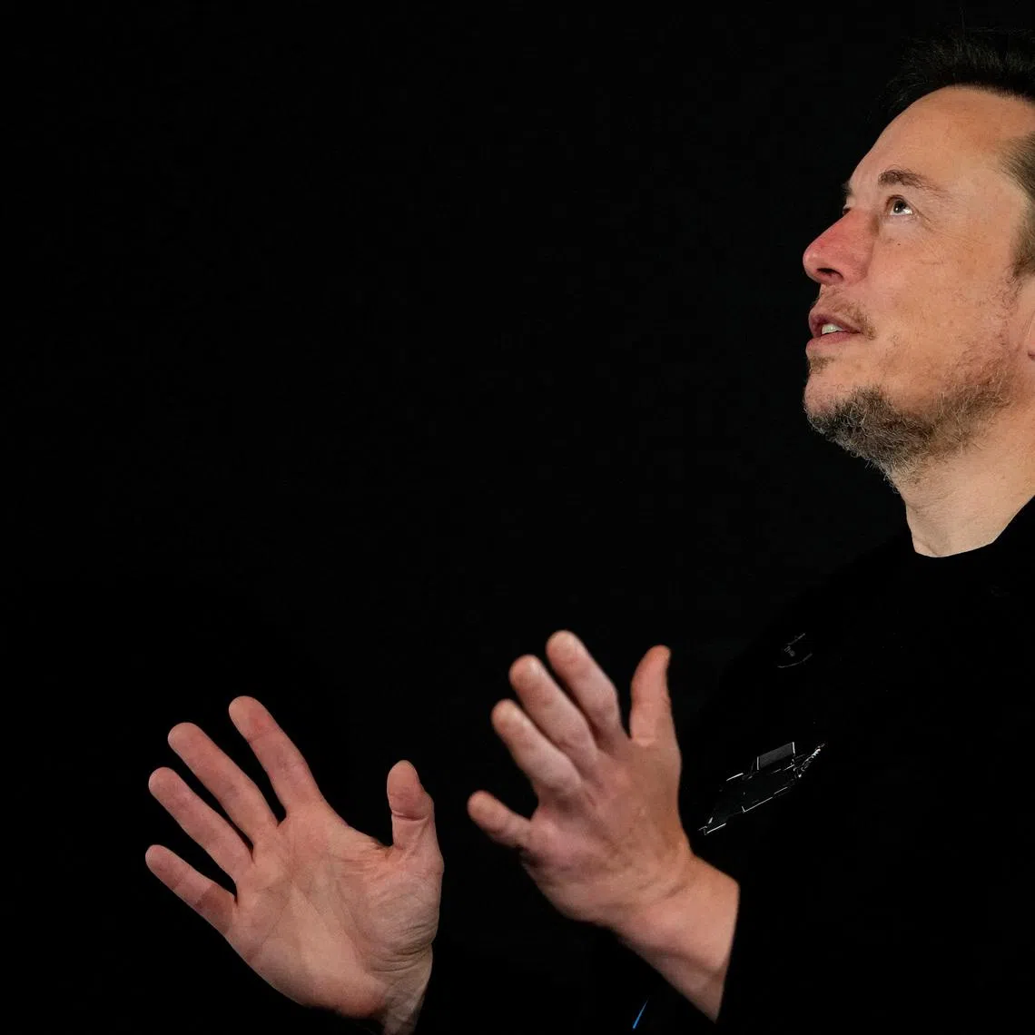 FILE PHOTO: Tesla and SpaceX's CEO Elon Musk reacts during an in-conversation event with British Prime Minister Rishi Sunak in London, Britain, November 2, 2023. Kirsty Wigglesworth/Pool via REUTERS/File Photo