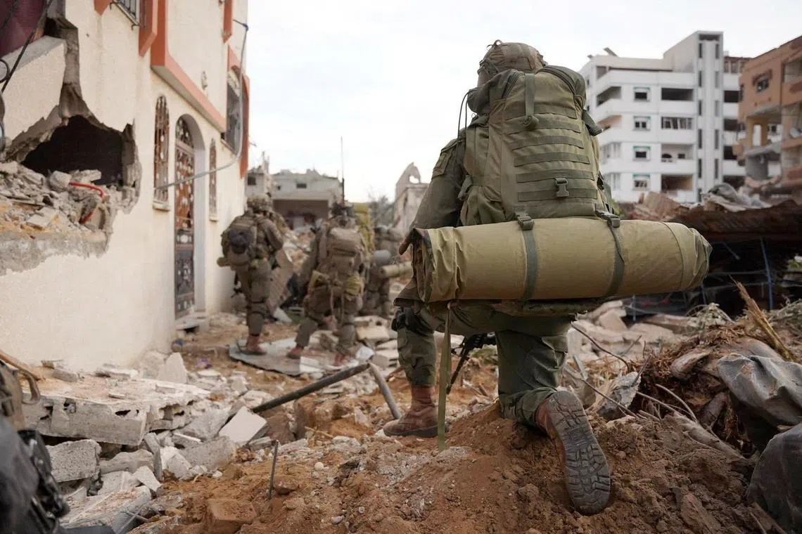 Israeli soldiers operate in the Gaza Strip, amid their ongoing operation against  Palestinian militant group Hamas.