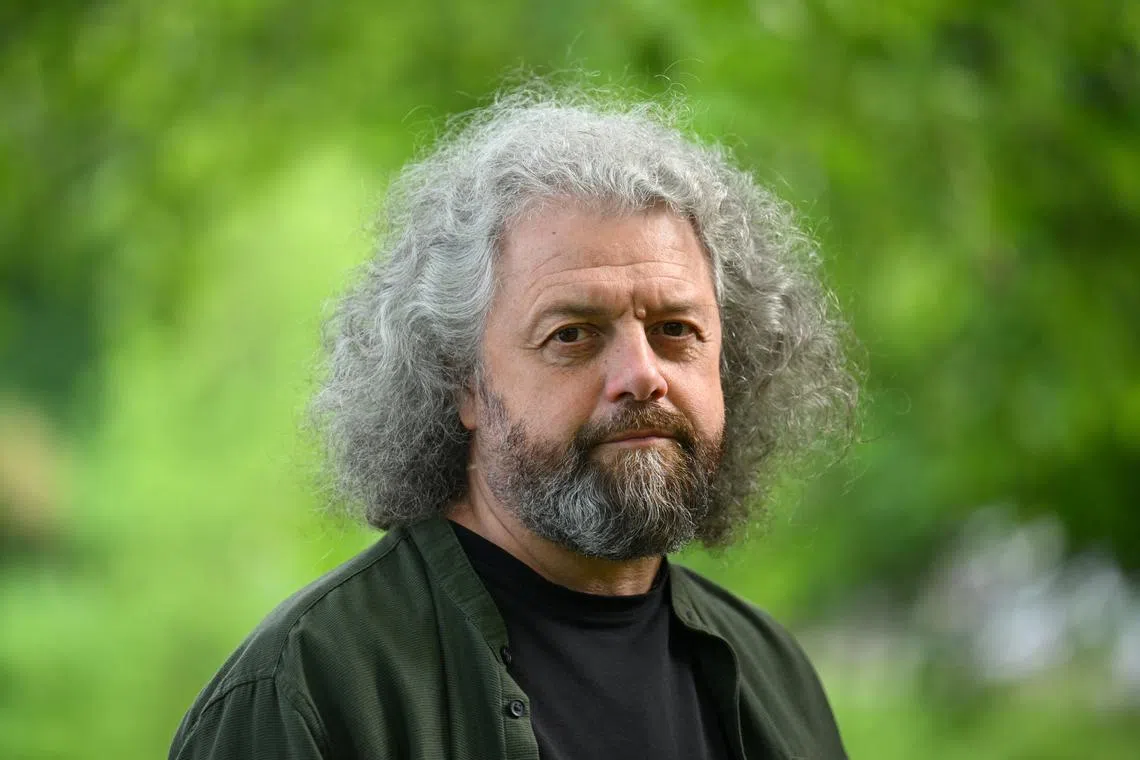 FILE PHOTO: Belarusian poet and publisher Dmitri Strotsev poses for a photo in Berlin, Germany May 27, 2025. REUTERS/Annegret Hilse/File Photo