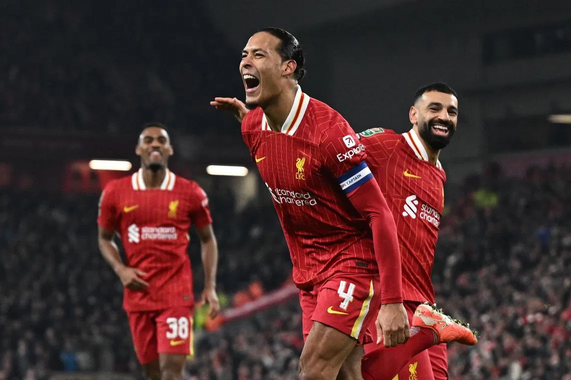Soccer Football - Carabao Cup - Semi Final - Second Leg - Liverpool v Tottenham Hotspur - Anfield, Liverpool, Britain - February 6, 2025 Liverpool's Virgil van Dijk celebrates scoring their fourth goal with Mohamed Salah REUTERS/Dylan Martinez
