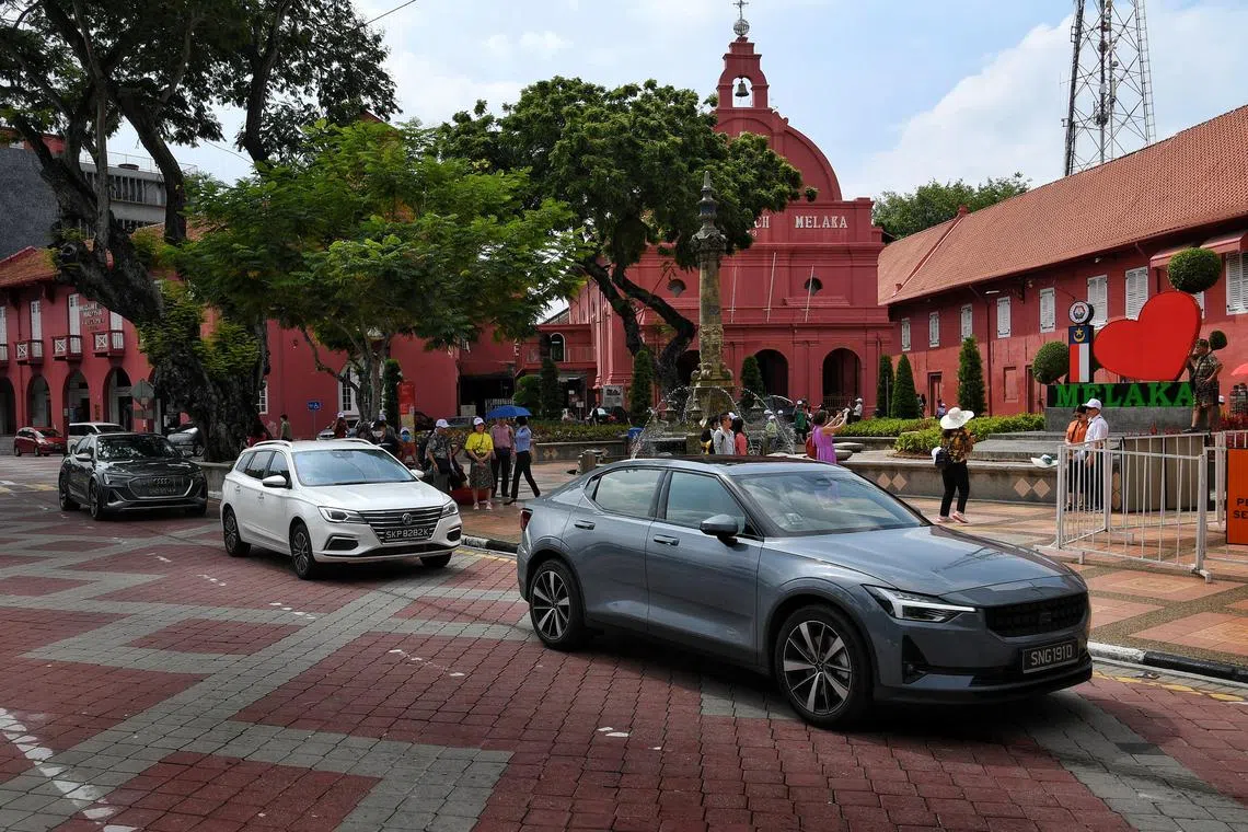 ST Motoring writers drove in three electric vehicles (EVs) – (from left) a luxury Audi e-tron S Sportback, a mass-market MG 5 Exclusive station wagon and a mid-range Polestar 2 Long Range Single Motor, for a road trip to Malaysia, where they also visited the historical city of Melaka.