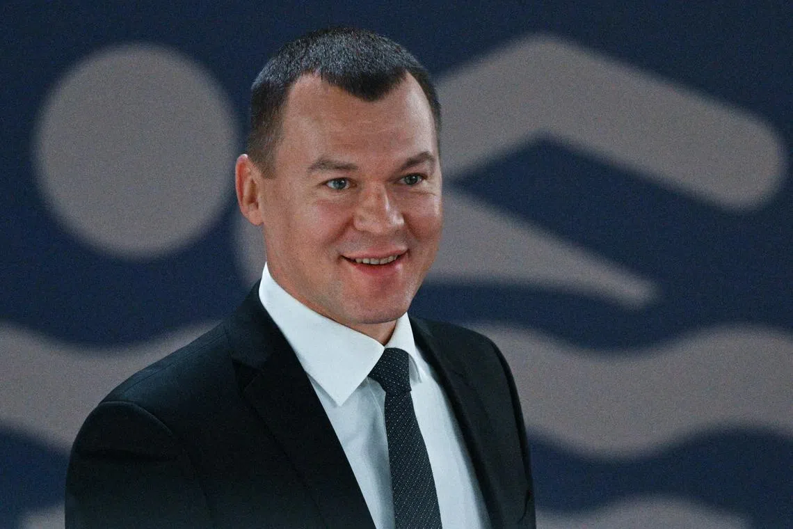 In this pool photograph distributed by the Russian state agency Sputnik, Russia's Sports Minister Mikhail Degtyarev attends a meeting of the presidential council for the development of physical culture and sports in Ufa on Oct 17. 