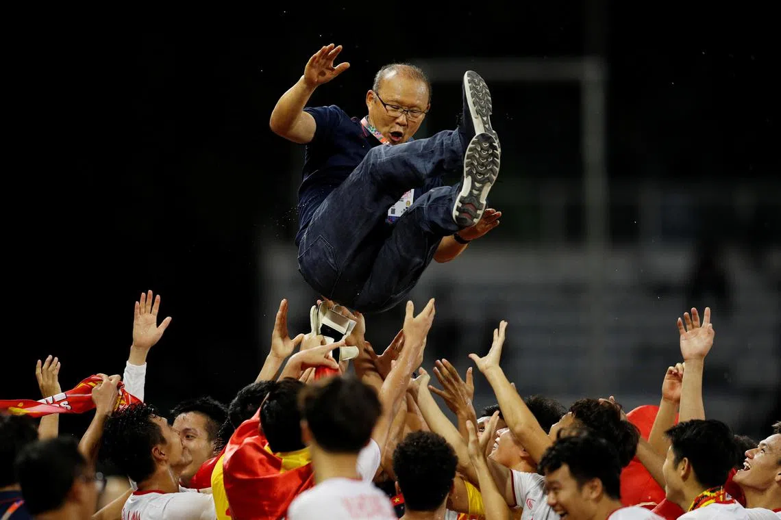 Southeast Asian Games - Soccer Football - Indonesia v Vietnam - Final - Rizal Memorial Stadium, Manila, Philippines - December 10, 2019       Vietnam coach Park Hang-seo celebrates with their players after they won the final   REUTERS/Soe Zeya Tun