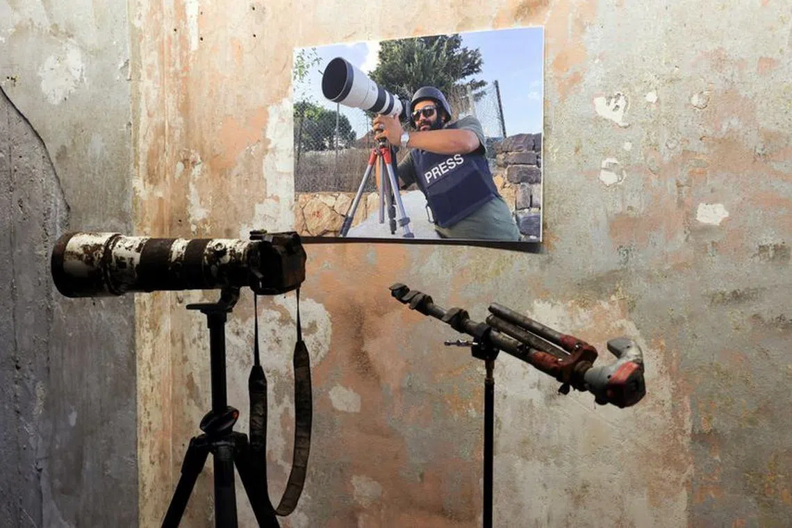 The gear that belonged to Reuters journalist Issam Abdallah who was killed on October 13 by what a Reuters investigation has found was an Israeli tank crew, is displayed during a press conference by Amnesty International and Human Rights Watch as they released findings from their investigations into the deadly October 13 strikes by Israel on southern Lebanon, in Beirut, Lebanon, December 7, 2023. REUTERS/Emilie Madi