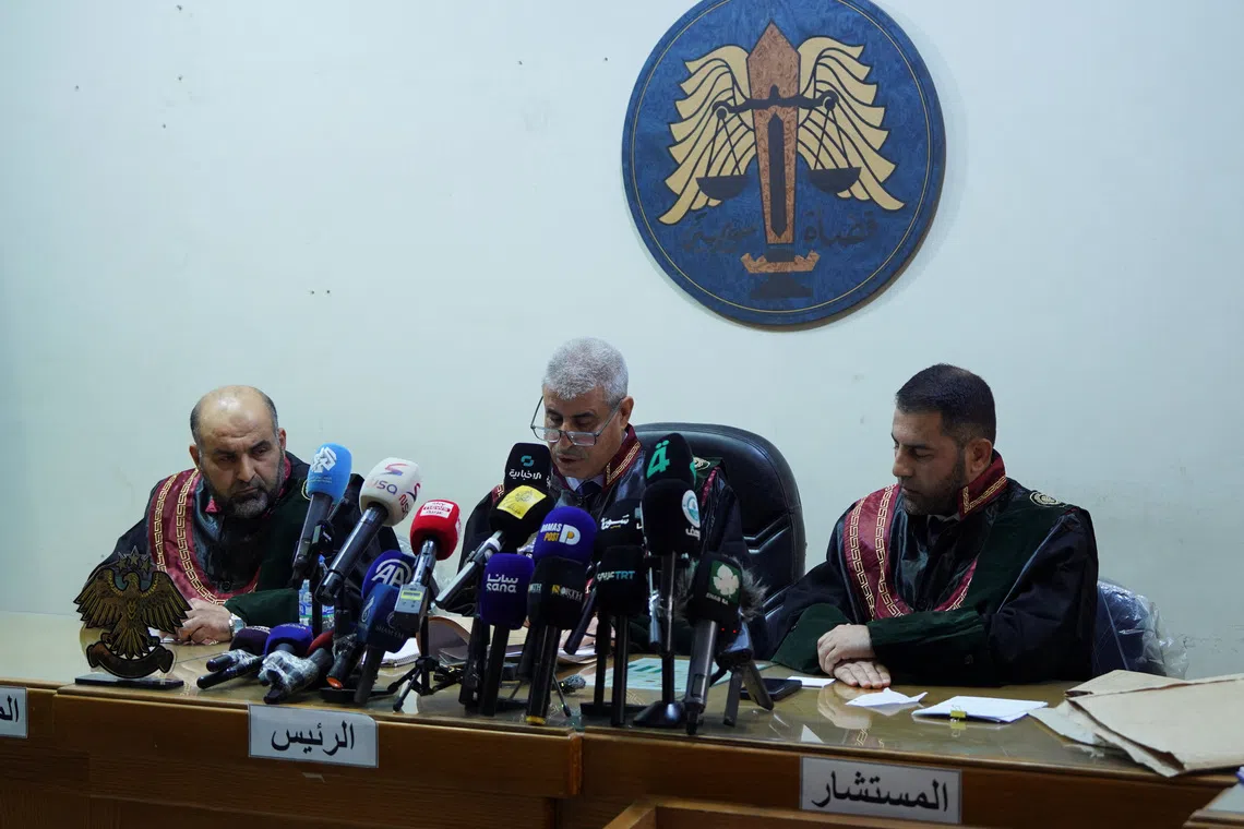 A judge speaks during the trial at the Palace of Justice, as Syria began the trial of a first group drawn from hundreds of defendants allegedly involved in the mass killings of Alawites last March, in Aleppo, Syria, November 18, 2025. REUTERS/Karam al-Masri