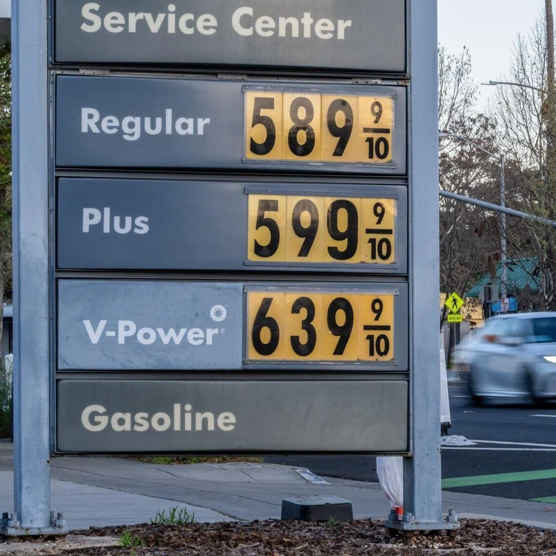 A sign displays the prices of unleaded gasoline at a gas station in California, on March 10, 2026. The resumption came as oil prices have spiked during the Iran war, restricting access to the Strait of Hormuz.