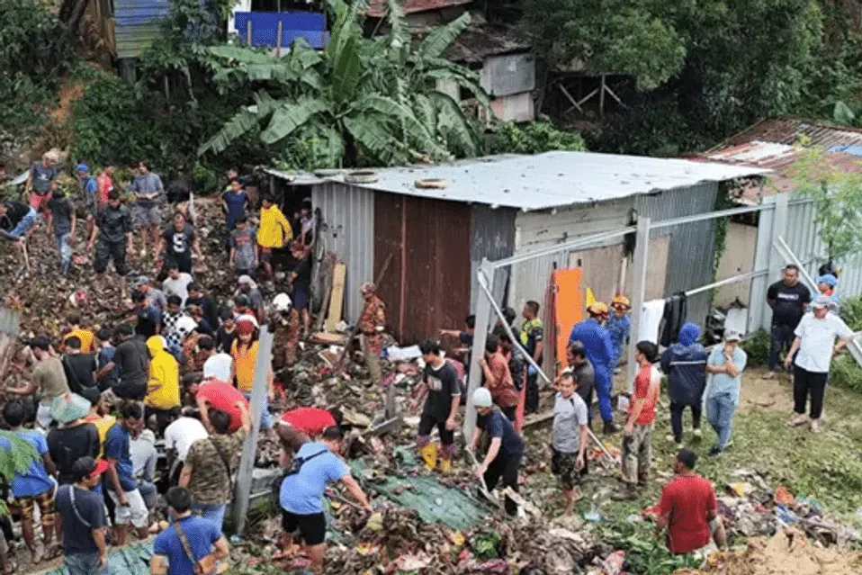 The worst tragedy occurred at Kampung Cenderakasih, where 11 members of a family were buried when a landslide flattened their wooden home in a squatter settlement along a hillside.