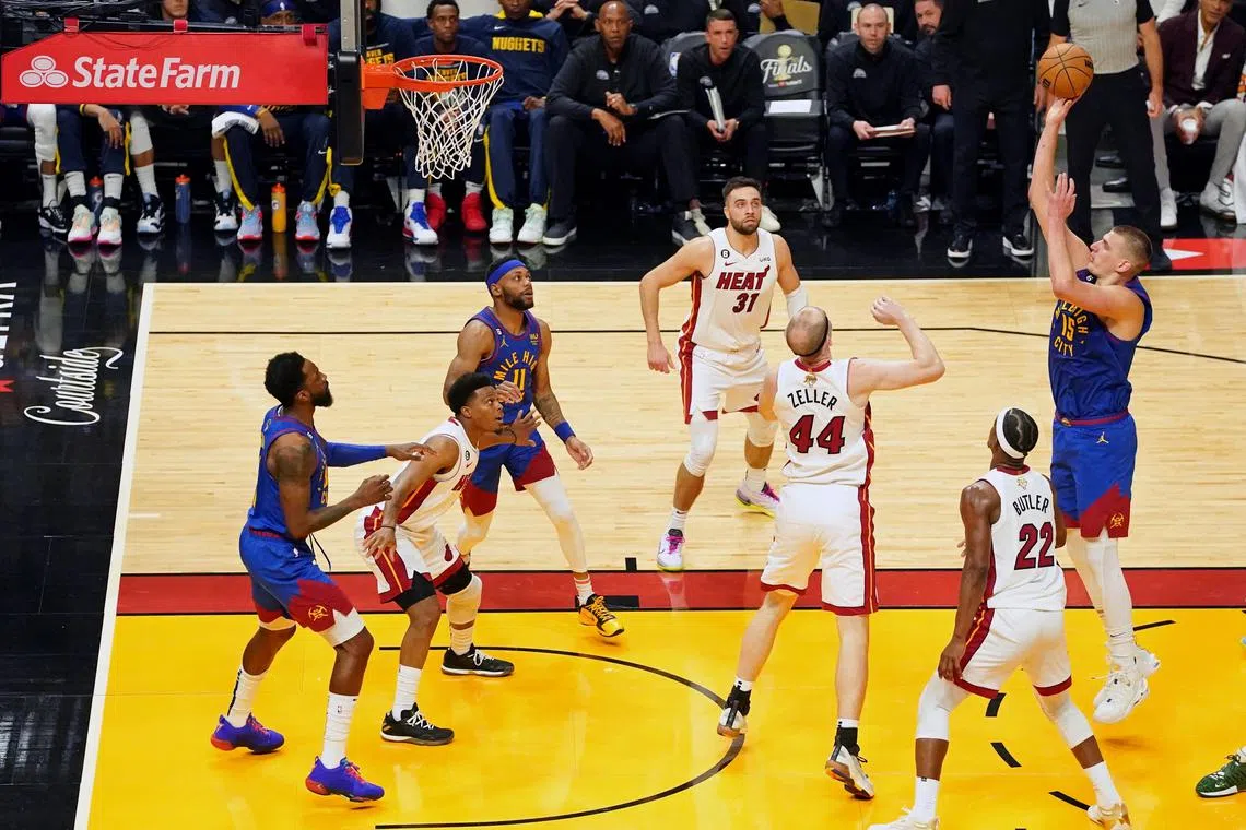 Jun 7, 2023; Miami, Florida, USA; Denver Nuggets center Nikola Jokic (15) shoots the ball against the Miami Heat during the first half in game three of the 2023 NBA Finals at Kaseya Center. Mandatory Credit: Kyle Terada-USA TODAY Sports