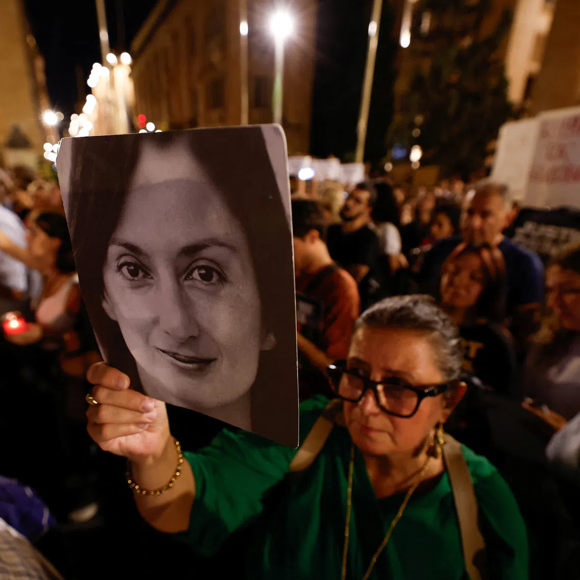 Mandy Mallia, sister of investigative journalist Daphne Caruana Galizia, holds a poster bearing Daphne's portrait during a protest organized by civil society group Repubblika following the acquittal of Maltese businessman Yorgen Fenech, who had been accused of complicity in the 2017 murder of investigative journalist Daphne Caruana Galizia, in Valletta, Malta, September 16, 2026. REUTERS/Darrin Zammit Lupi