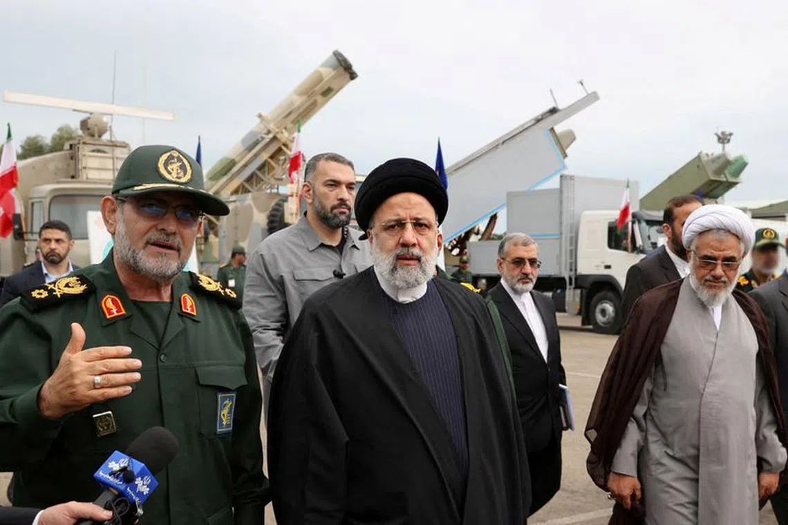 FILE PHOTO: Iranian President Ebrahim Raisi inspects military equipment at a Revolutionary Guards naval site in Bandar Abbas, Iran, February 2, 2024. Iran's Presidency/WANA (West Asia News Agency)/Handout via REUTERS/File Photo