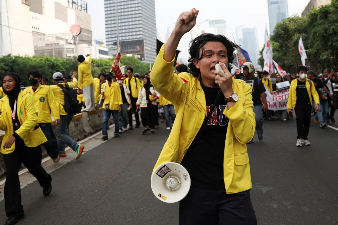 A student uses a megaphone to shout slogans during a protest against government policies, including state budget spending, a fuel price hike, a free meals programme, and expanded military roles in civilian affairs, in Jakarta, Indonesia, June 12, 2026. REUTERS/Ajeng Dinar Ulfiana