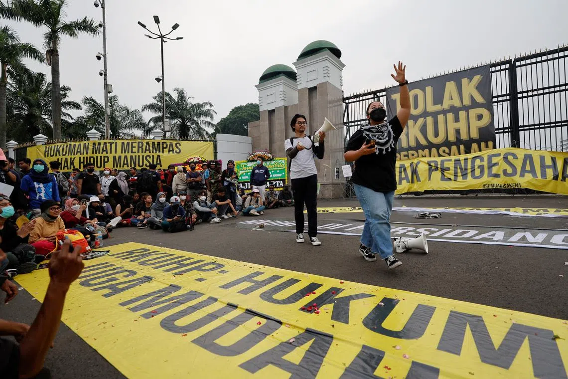 People protesting against the new laws outside the Indonesian Parliament buildings in Jakarta on Dec 5.
