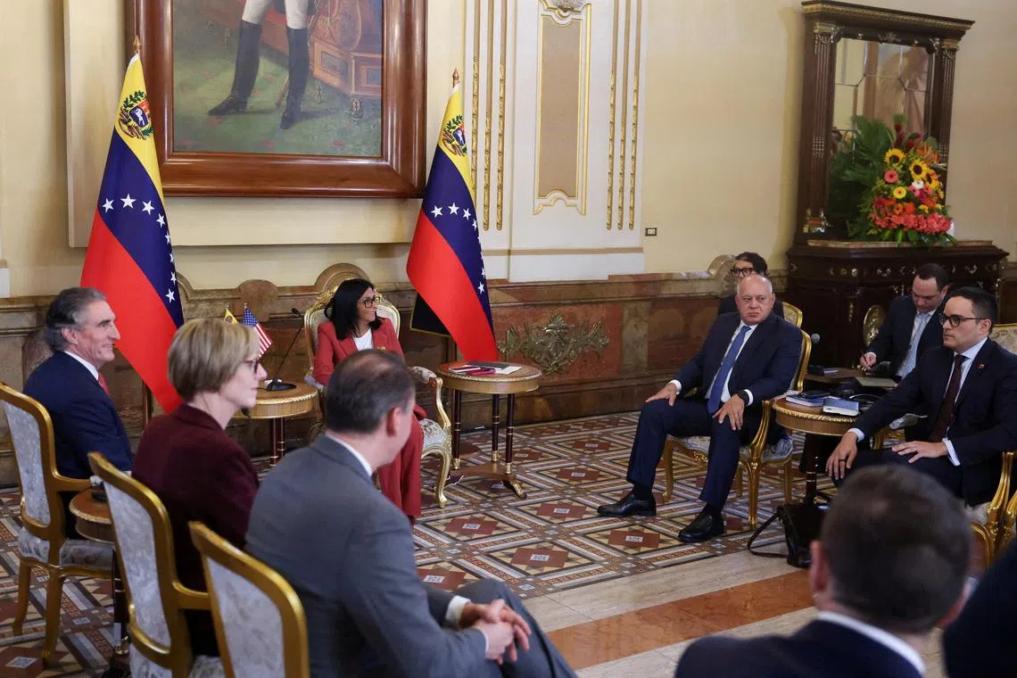 Venezuela's interim President Delcy Rodriguez meets with U.S. Interior Secretary Doug Burgum, with Venezuela's Interior Minister Diosdado Cabello sitting in the room, in Caracas, Venezuela, March 4, 2026. REUTERS/Leonardo Fernandez Viloria
