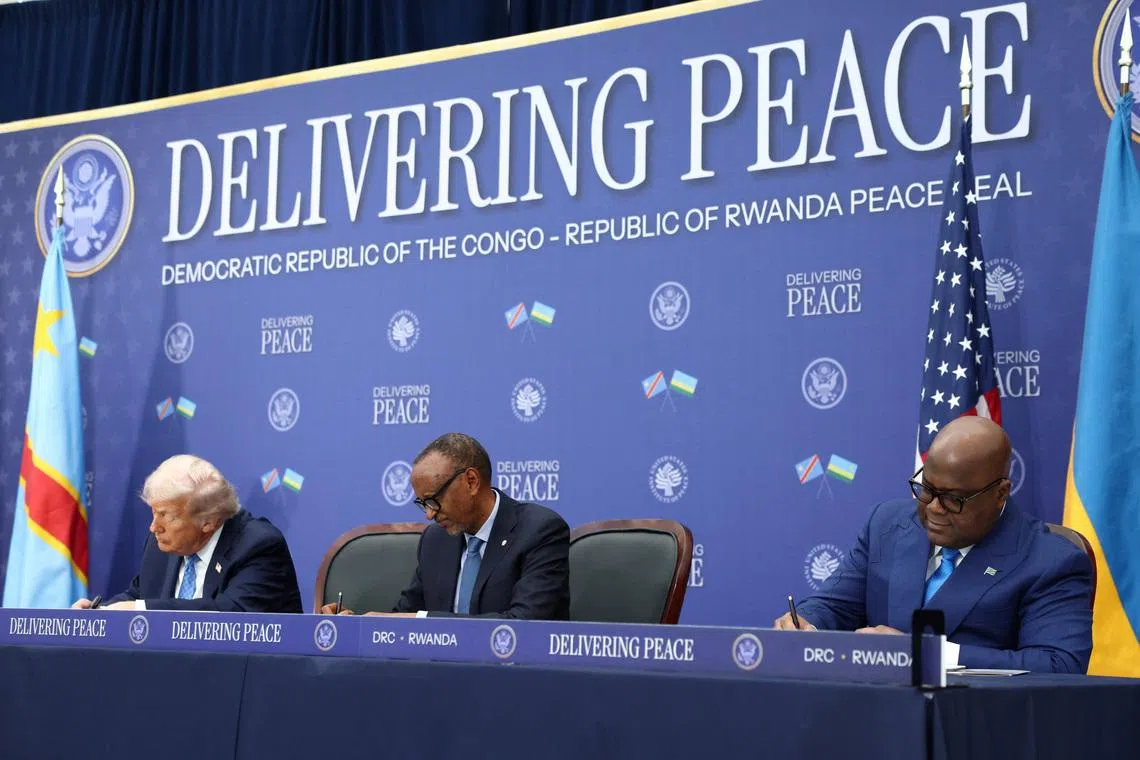 U.S. President Donald Trump, President of the Democratic Republic of the Congo Felix Tshisekedi and President of Rwanda Paul Kagame take part in a signing ceremony at the U.S. Institute of Peace in Washington, D.C., U.S., December 4, 2025. REUTERS/Kevin Lamarque/File Photo