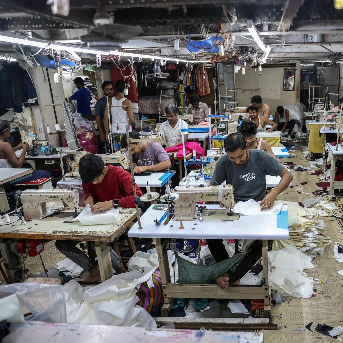 epa12288249 Indian labourers work at a Red Fashion Textile workshop manufacturing garments in the Dharavi area of Mumbai, India, 07 August 2025. In an escalation of trade tensions between the United States and India, US President Donald Trump, on 06 August 2025, signed an executive order imposing a 25 per cent ad valorem tariff on all Indian imports into the United States. The ad valorem duty imposed in Executive Order 14257 would apply in addition to the ad valorem duty imposed in section 2 of the order. This effectively means some categories of Indian exports may face a combined tariff burden of over 50 per cent, depending on their classification.  EPA/DIVYAKANT SOLANKI