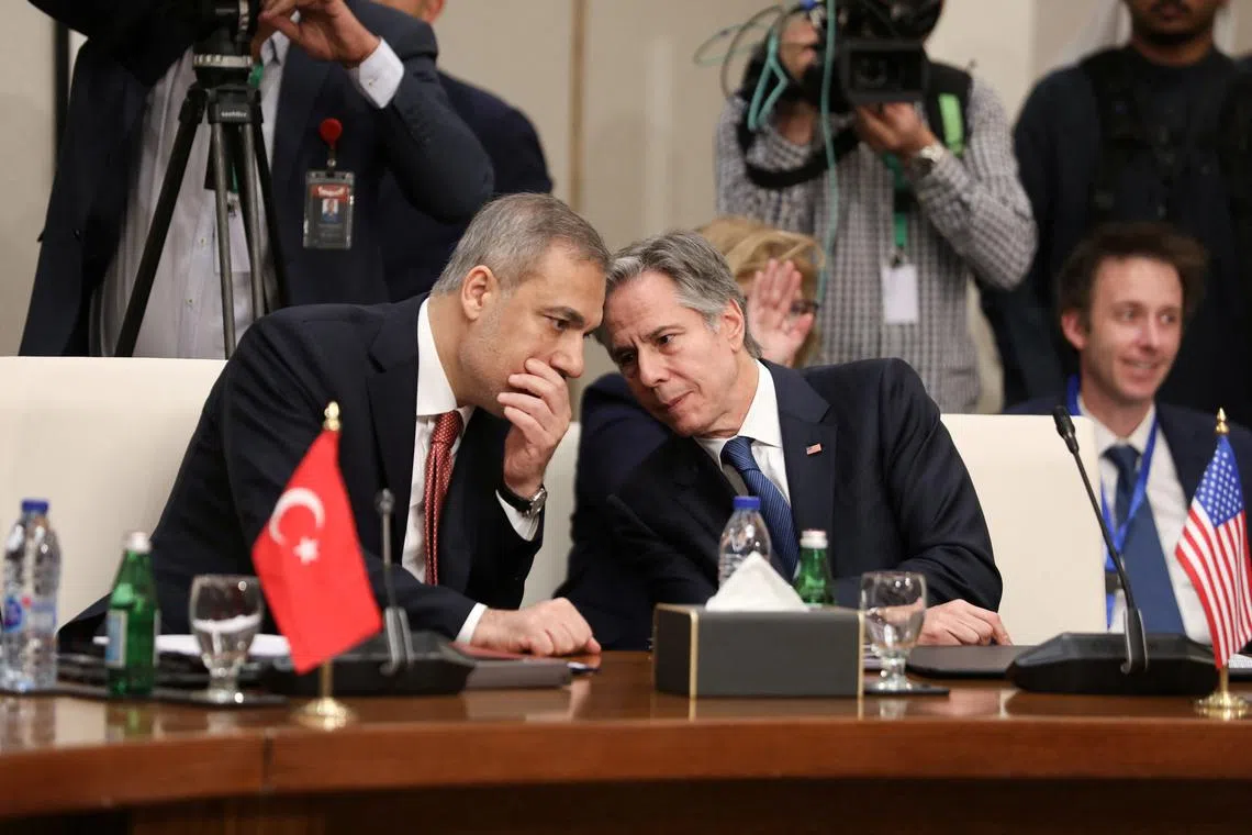 U.S. Secretary of State Antony Blinken and Turkish Foreign Minister Hakan Fidan attend a meeting with foreign ministers of Jordan, Saudi Arabia, Iraq, Lebanon, Egypt, United Arab Emirates, Bahrain, Qatar, Arab League Secretary-General Ahmed Aboul Gheit, and High Representative of the European Union for Foreign Affairs and Security Policy Kaja Kallas, to discuss developments in Syria after fighters of the ruling Syrian body ousted Syria's Bashar al-Assad, in Aqaba, Jordan December 14, 2024. REUTERS/Alaa Al Sukhni