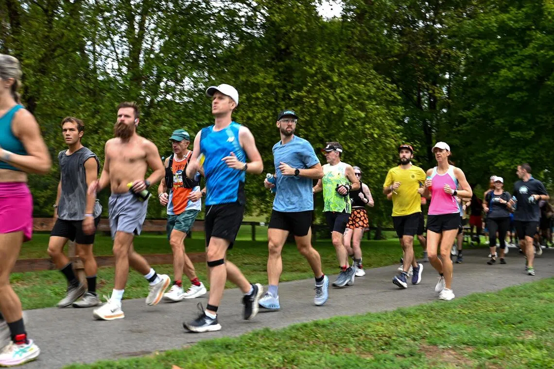Runners during the Prairie on Fire backyard ultra, in Cicero, Indiana, on Sept 12.