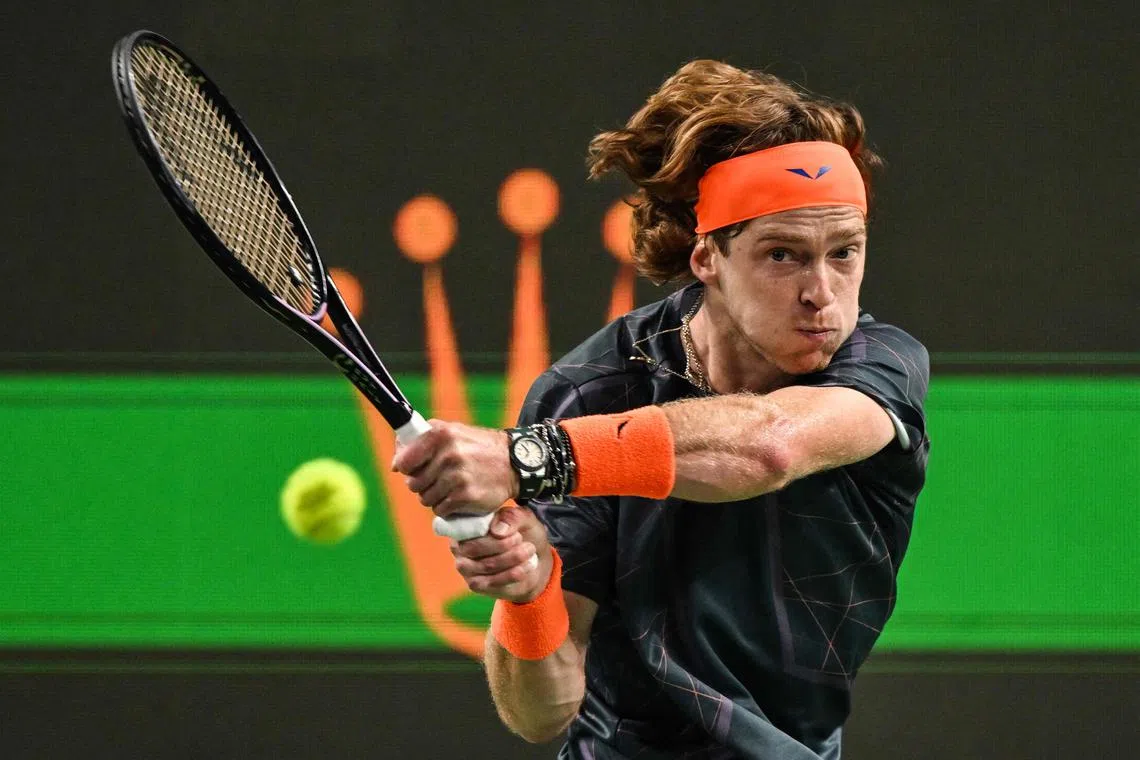 Russia's Andrey Rublev hitting a return to US's Tommy Paul during their men's singles match during the Shanghai Masters tennis tournament in Shanghai, China on Oct 11.